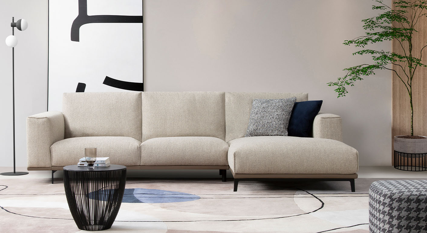 Duca cream fabric chaise sofa in a bright neutral room 