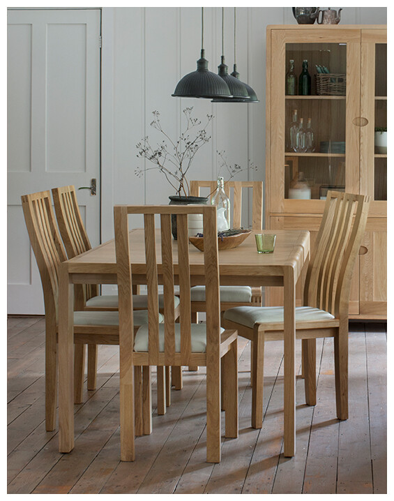 Ercol Bosco Extending Dining Table set in a modern dining room.