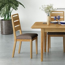 close up of the bexley modern oak dining chair in a bright white kitchen