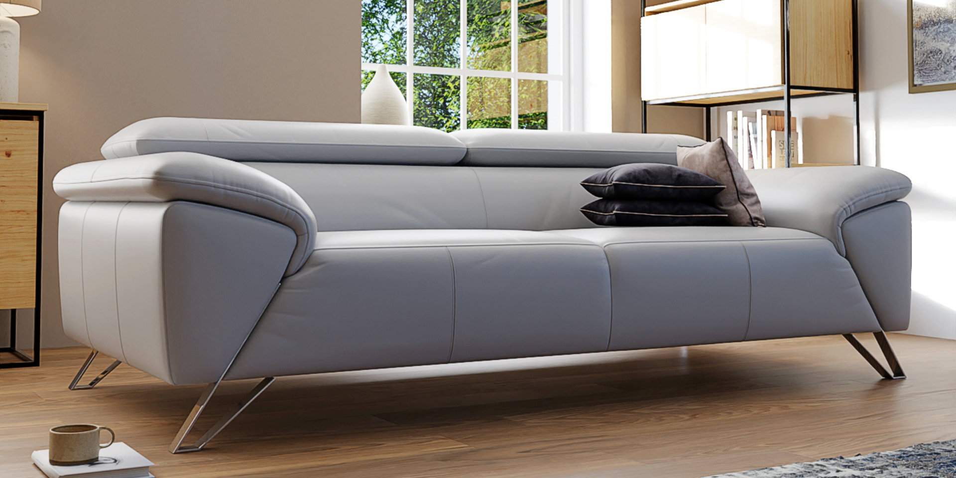 A light coloured Italian leather sofa with metal legs in a modern living room