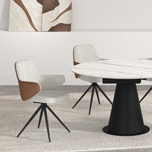 close up grey fabric sierra dining chair with round white marble dining table