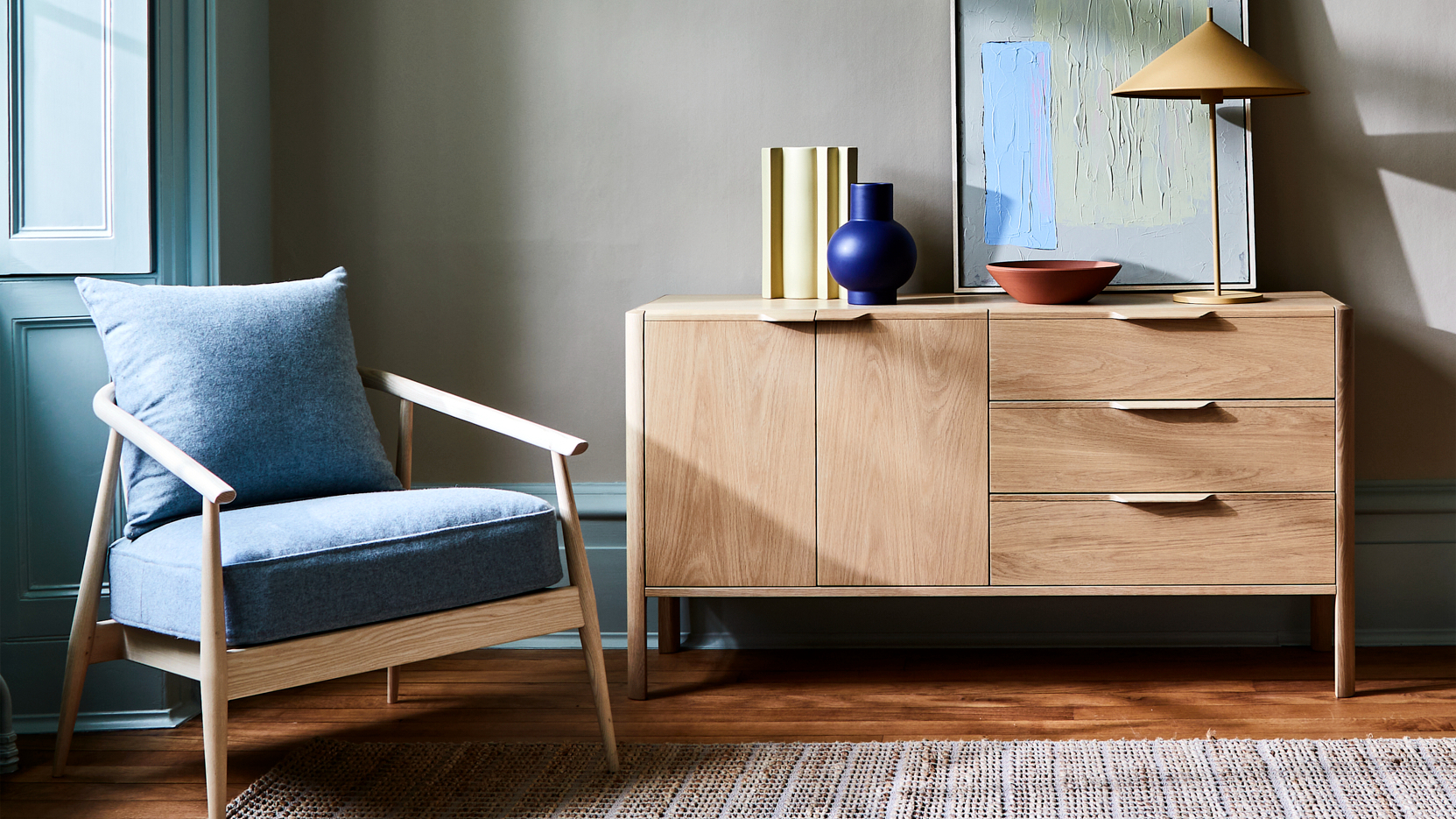 Ercol Aldbury Chair And Oak Sideboard In A Bright Livingroom with Wooden Flooring